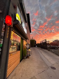 a restaurant with a red sky at sunset