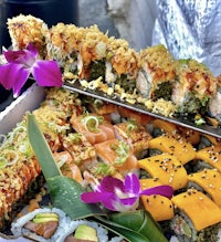 a box of sushi is sitting on a table