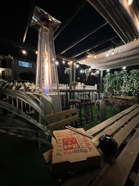 a restaurant with tables and chairs on a rooftop